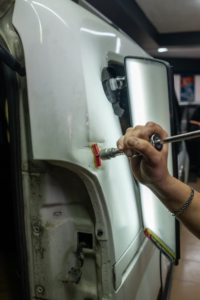 High Voltage Rules: What Changes at an Auto Body Shop When the Car Is an EV
